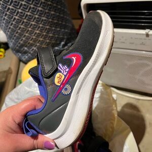 Nike Kids Black and Red Sneakers with Purple Accents